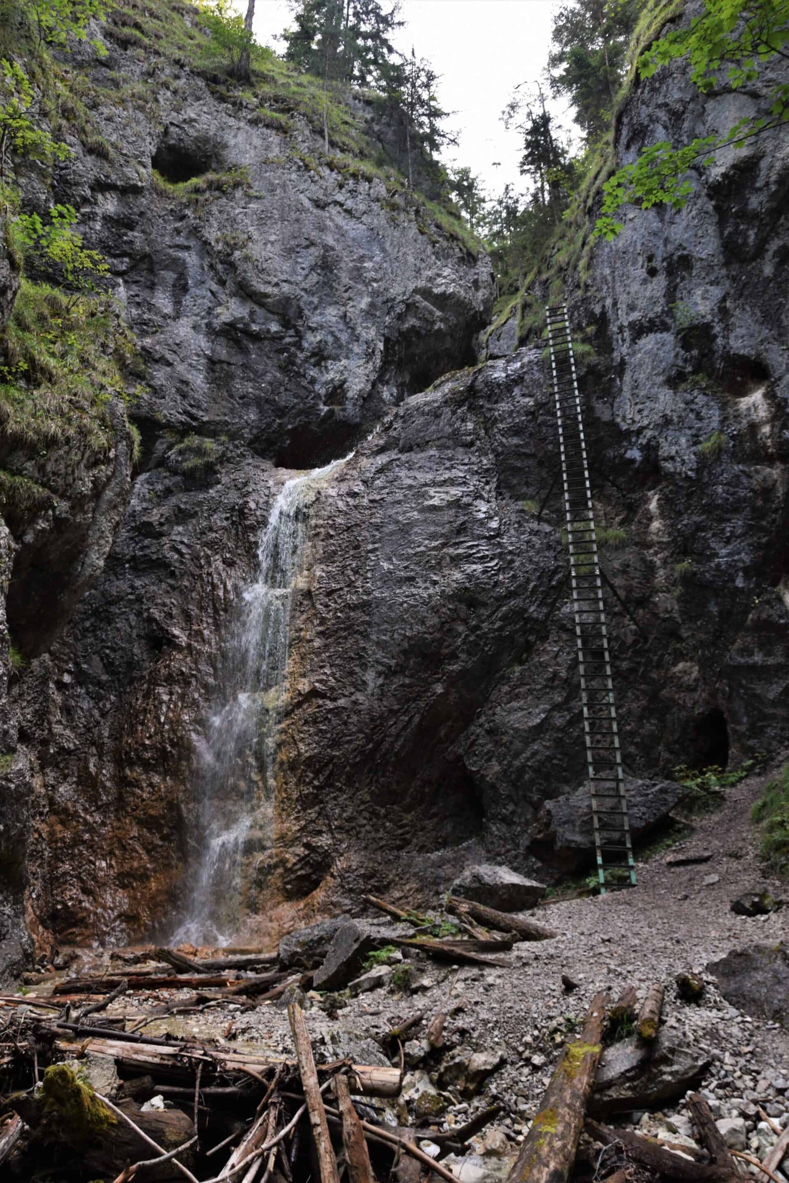 a 15-metre ladder leading up a rock face next to a waterfall, Small Stoves Gorge, Slovakia