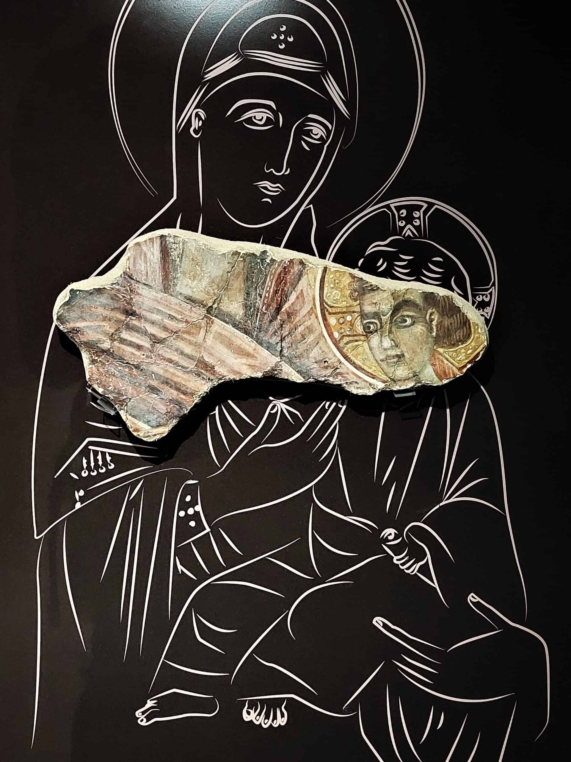 pieces of a religious wall fresco, showing a woman and a child, complemented by the stylized drawing of the missing parts, Argos, Greece