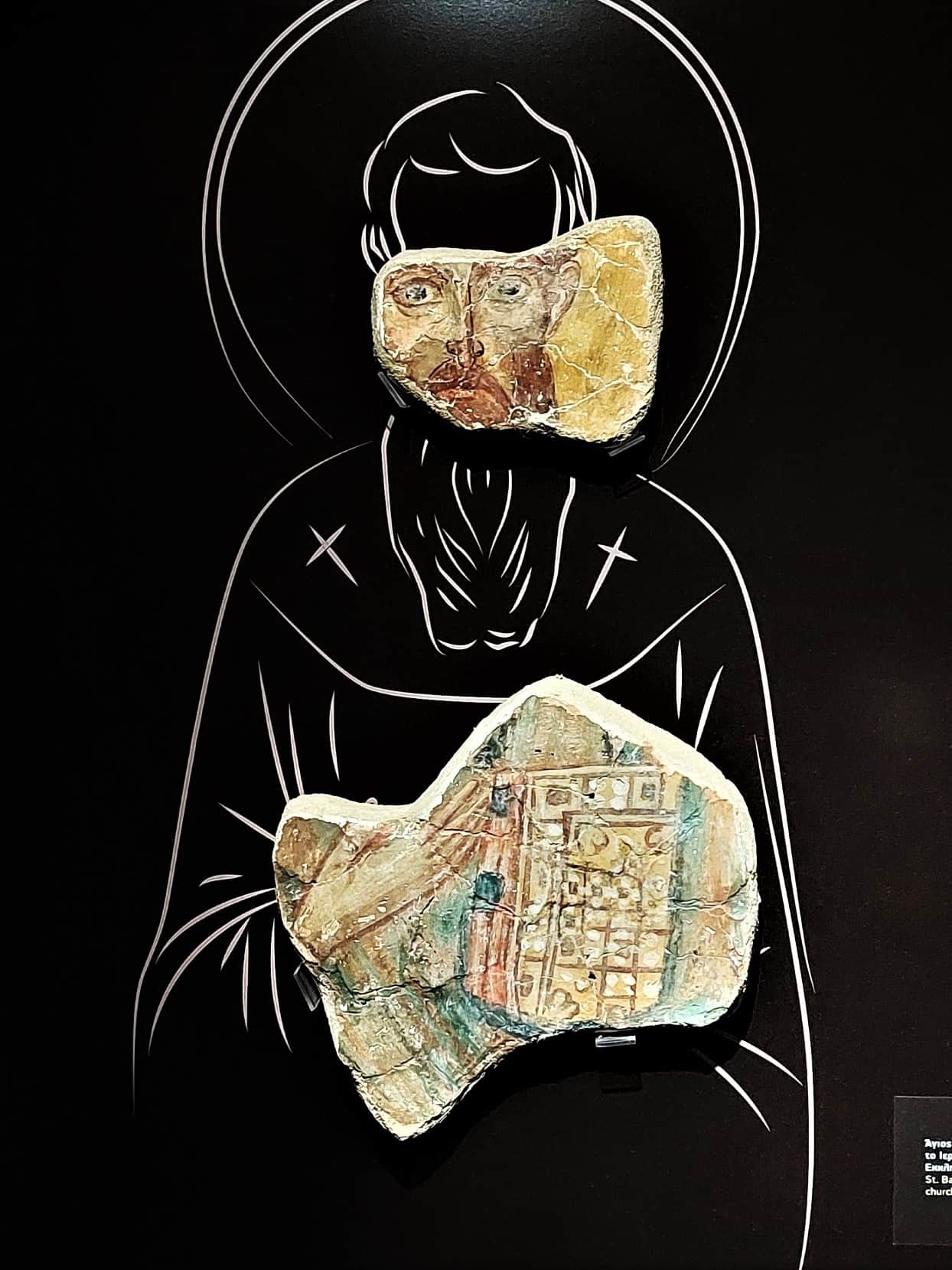 pieces of a wall fresco, showing a priest, complemented by the stylized drawing of the missing parts, Argos, Greece
