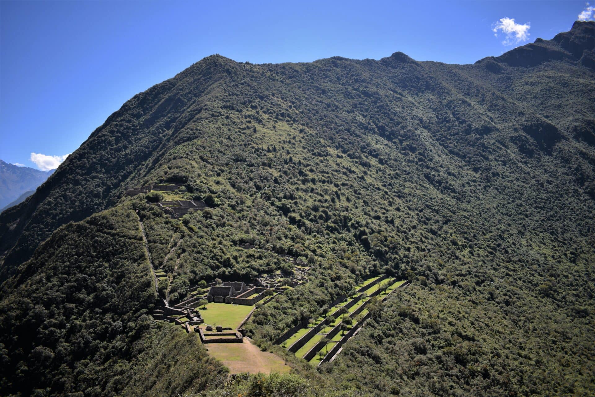 ancient Incan terraces and buildings uncovered at the slopes of a lush mountain