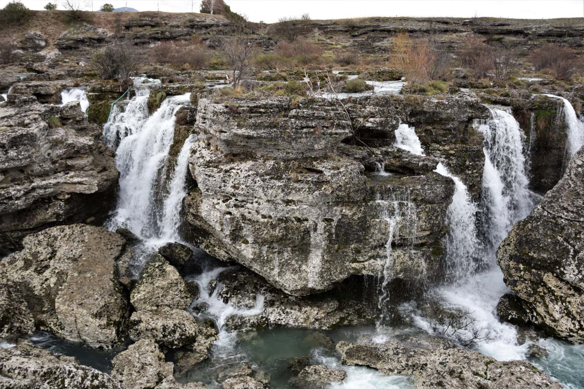 water cascades across a karst rock formation