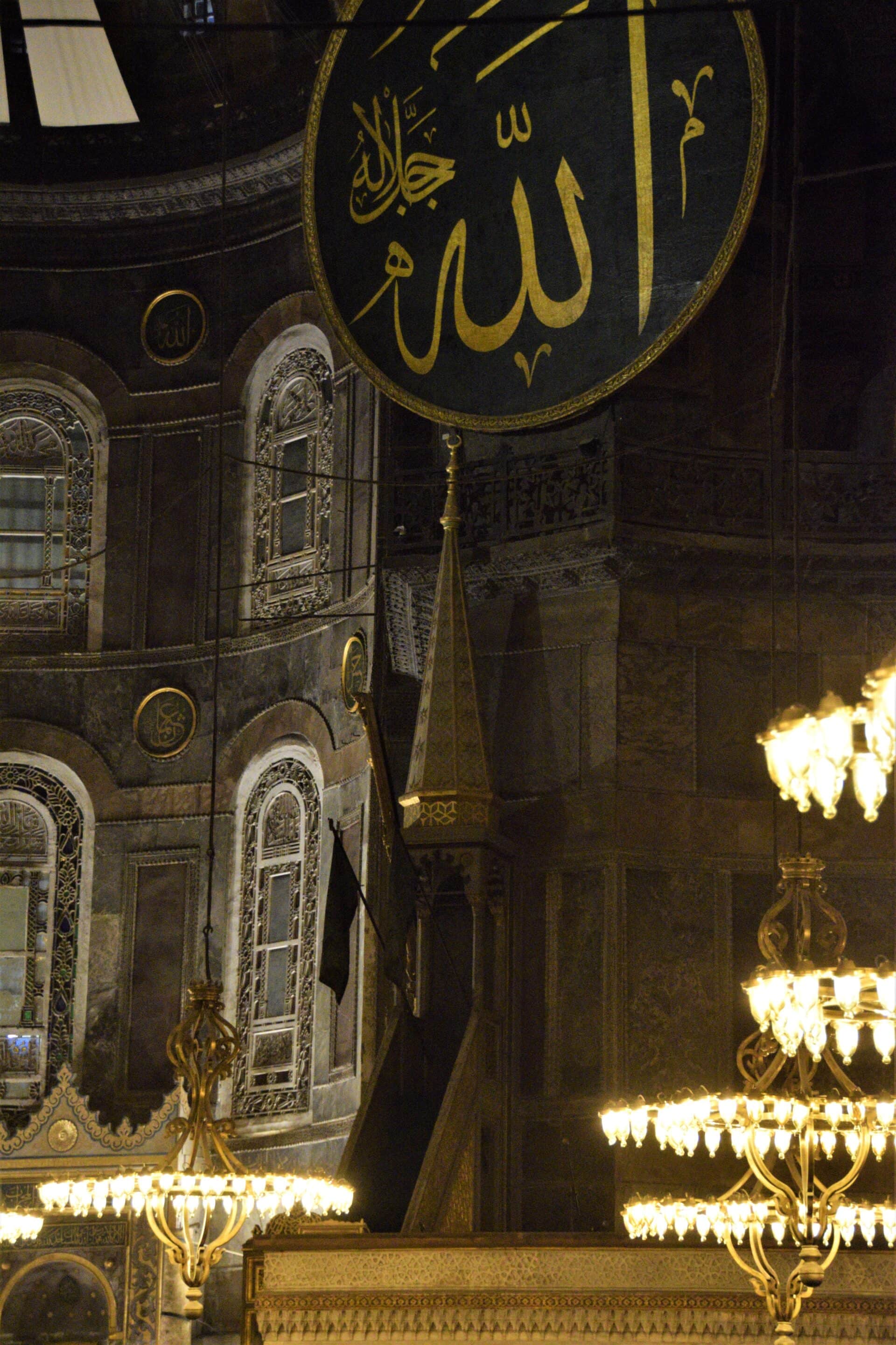 the minbar surrounded by chandeliers inside the Hagia Sophia