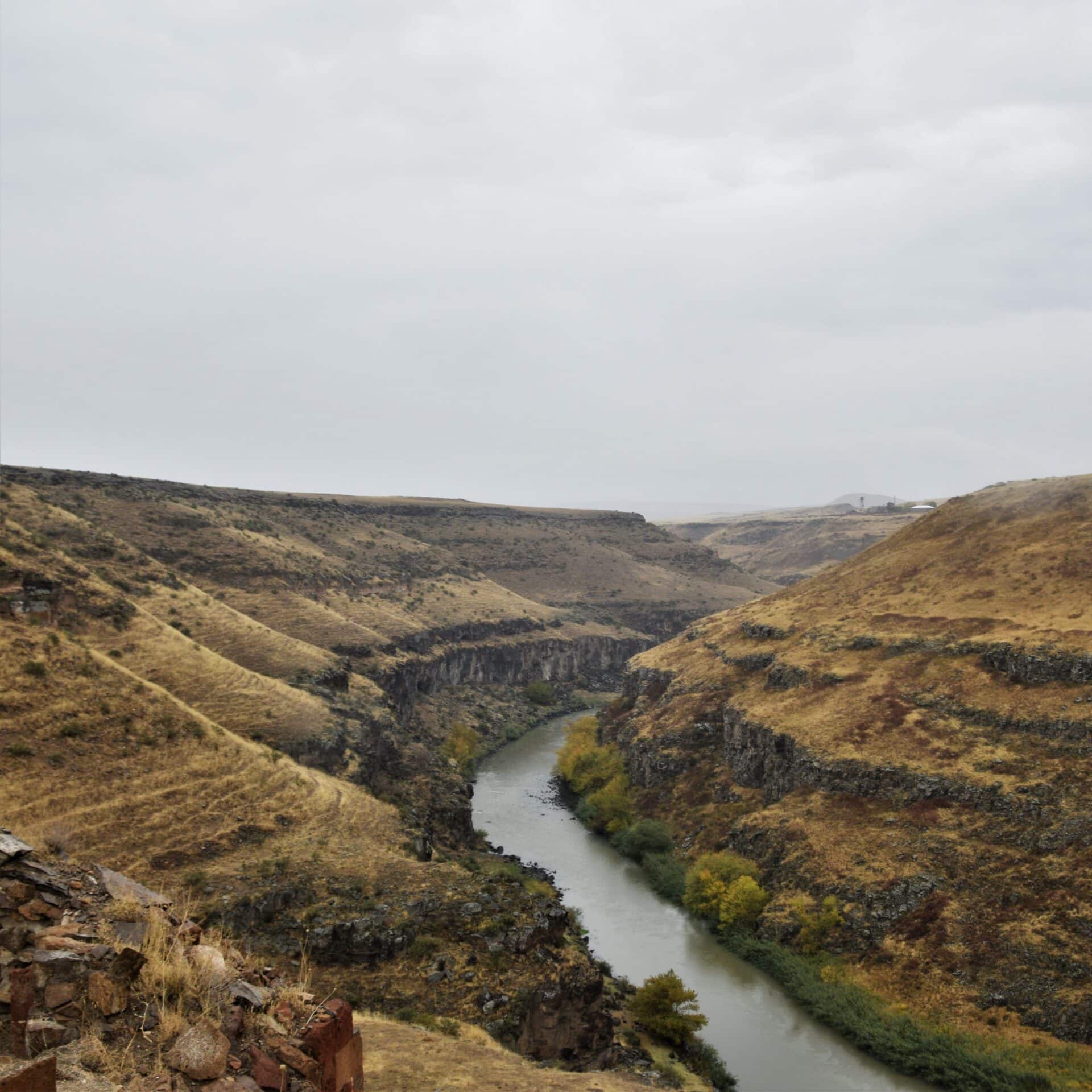a mighty river rusn through a wide canyon separating Armenia and Turkey