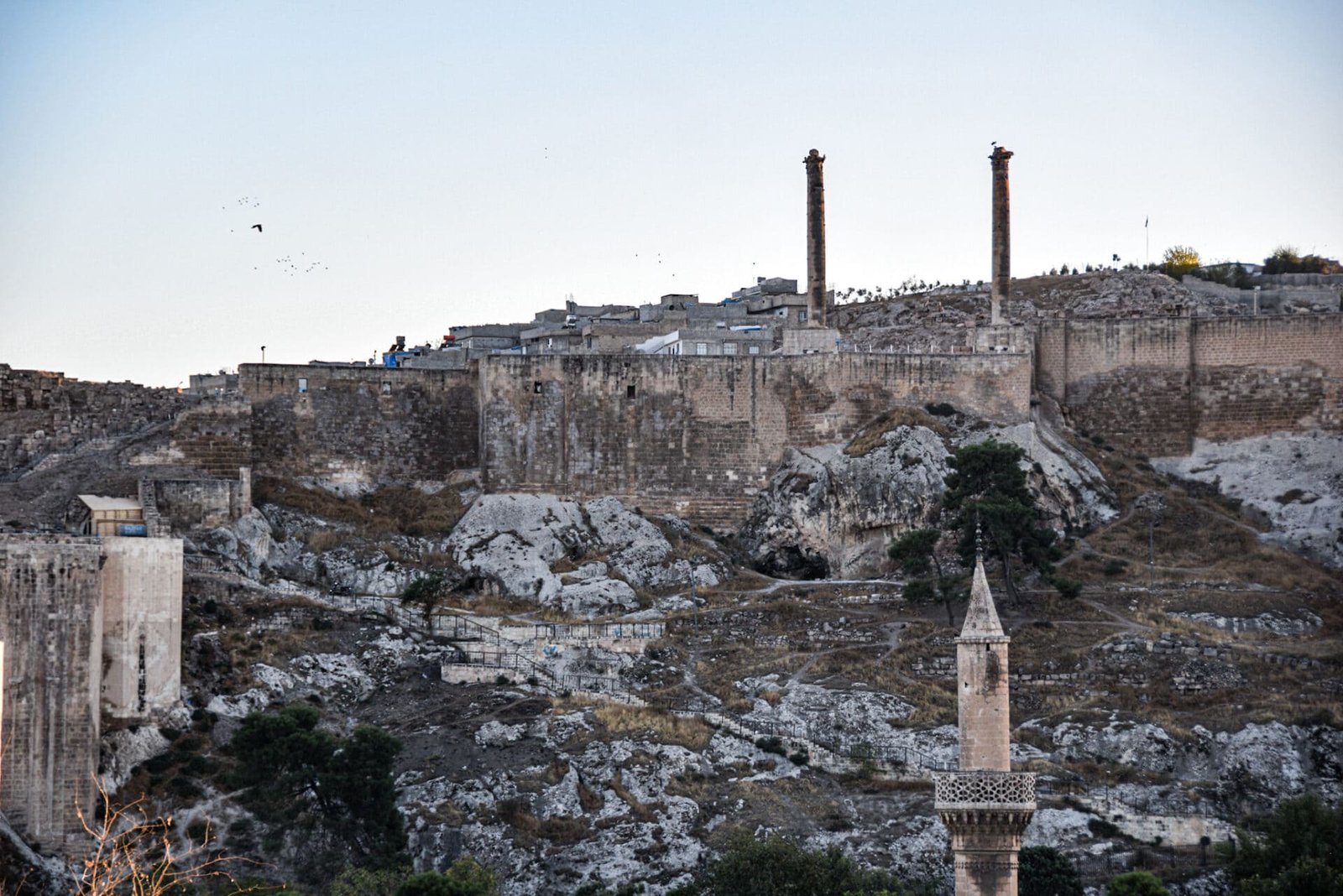 panoramic view of Sanliurfa citadel enthroned on a rocky hill towering above the old town