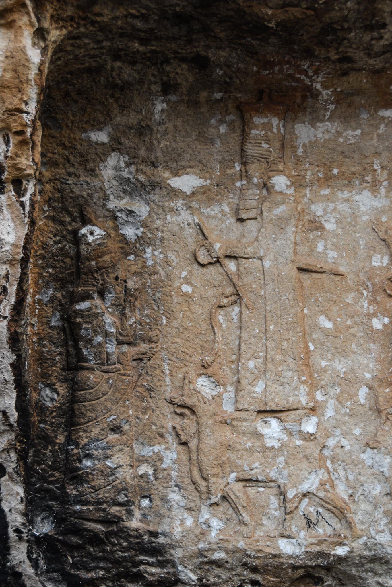a Neo-Assyrian bas-relief showing the king in front of a deity