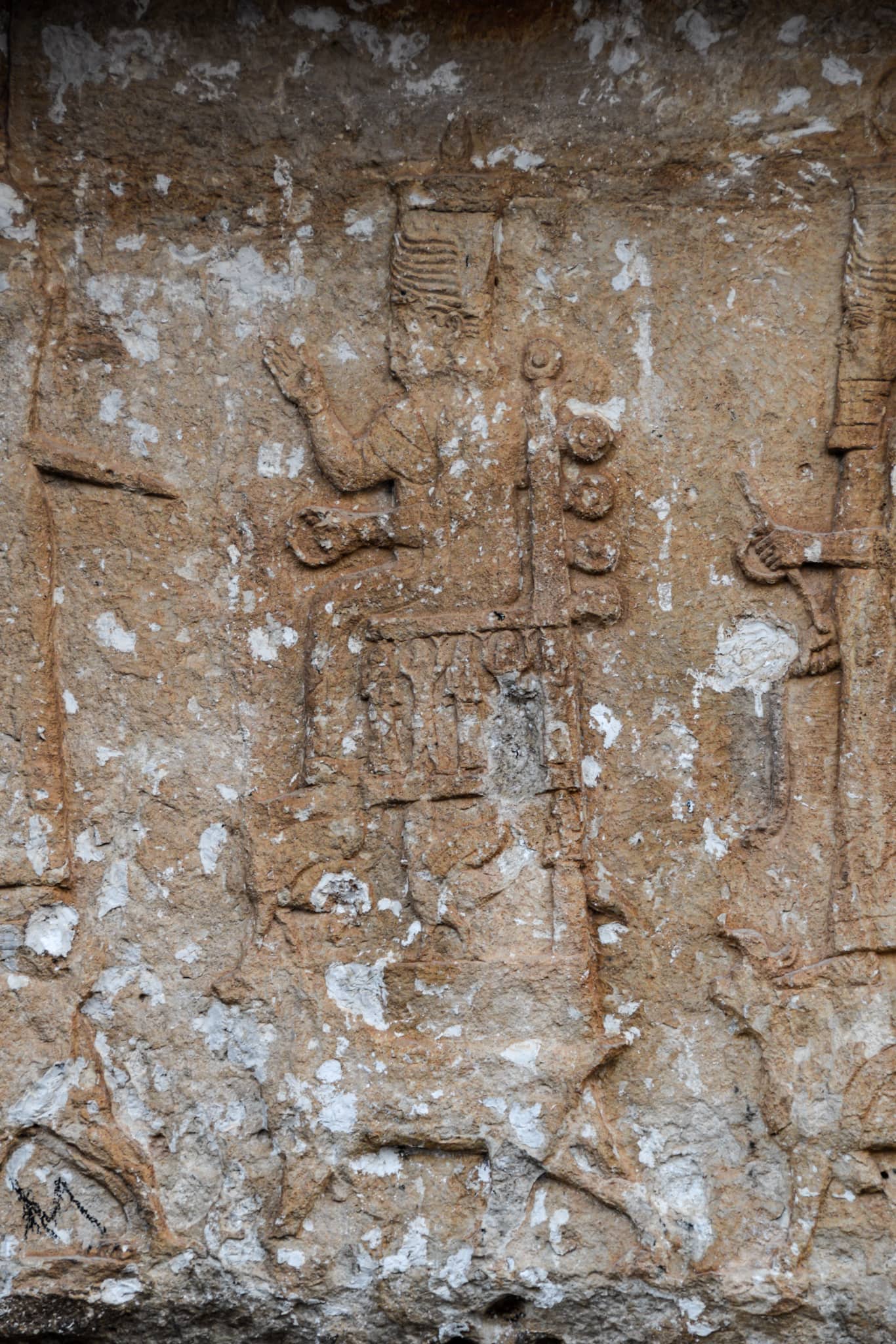 a Neo-Assyrian bas-relief depicting a Mesopotamian deity