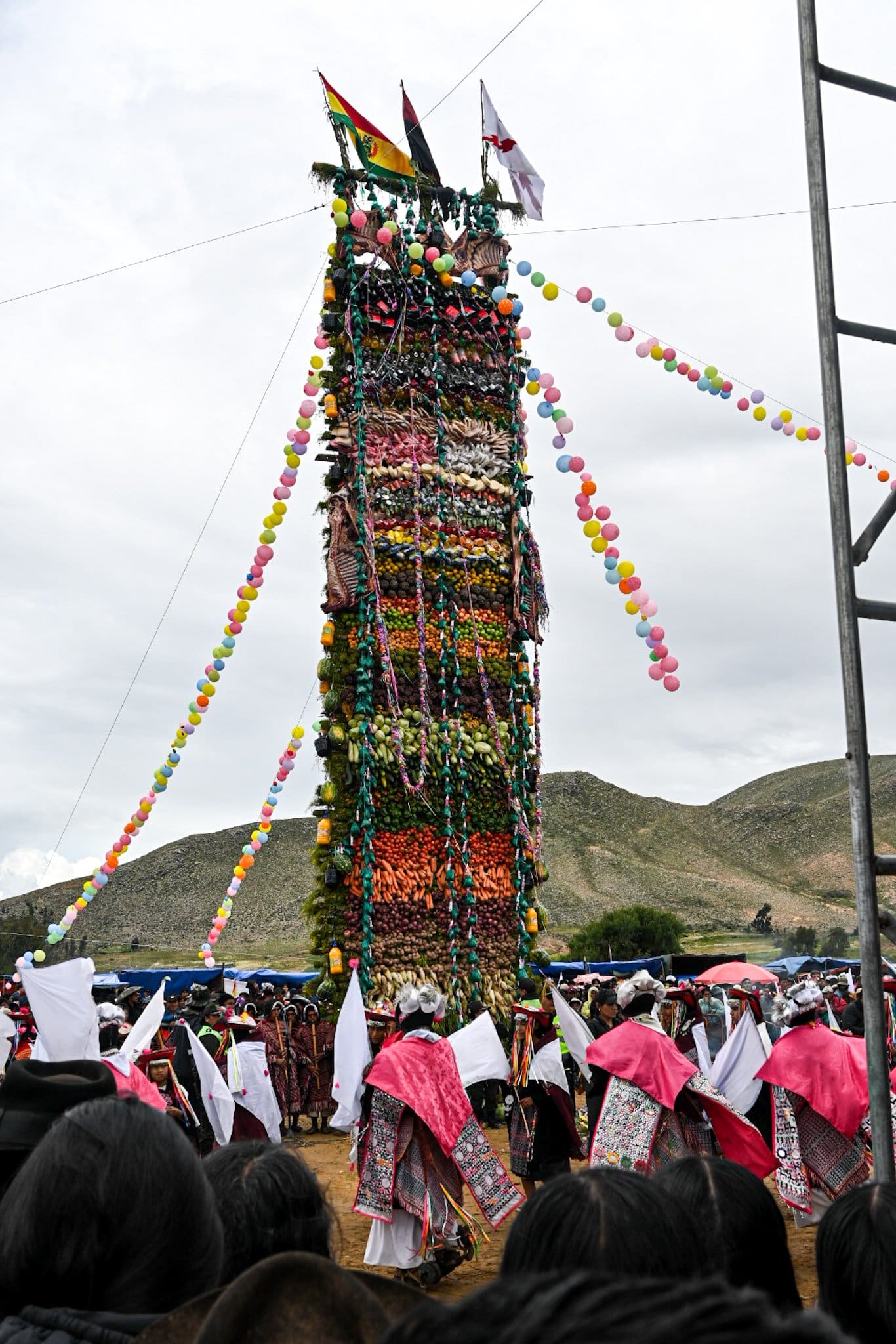 the altar of the Gran Pukara rises above a crowd during the festivites of Pujllay