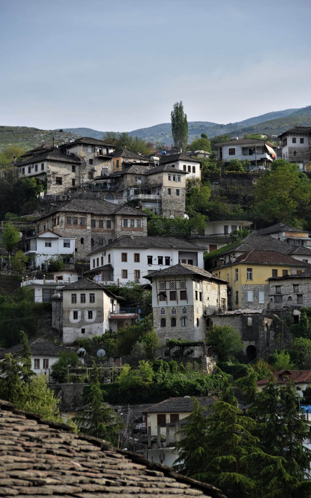 unique Ottoman houses gracing the steep slopes in Gjirokaster