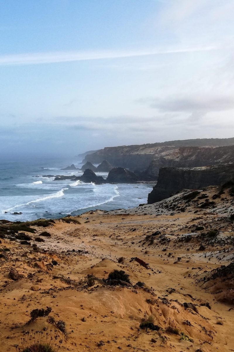 precipitous cliffs fall into the wild ocean at Portugal's Atlantic coast